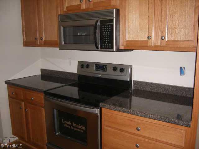 210 Link Road Reidsville, NC 27320 - Photo 4 of 7 Other. Kitchen features upgraded stainless steel range, microwave oven and dishwasher.