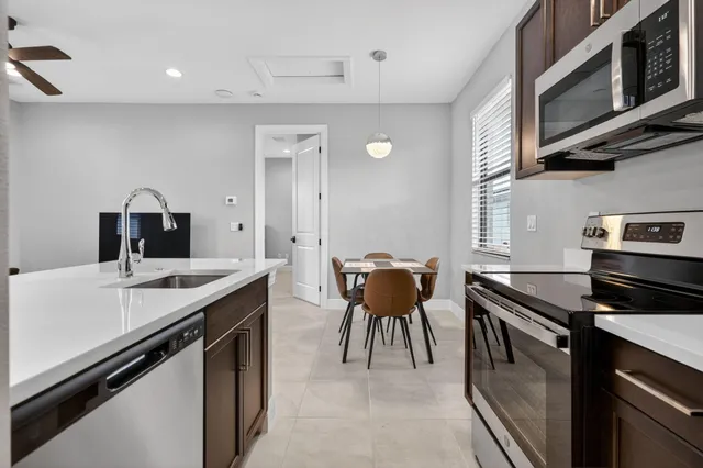 a kitchen with a stove and a microwave