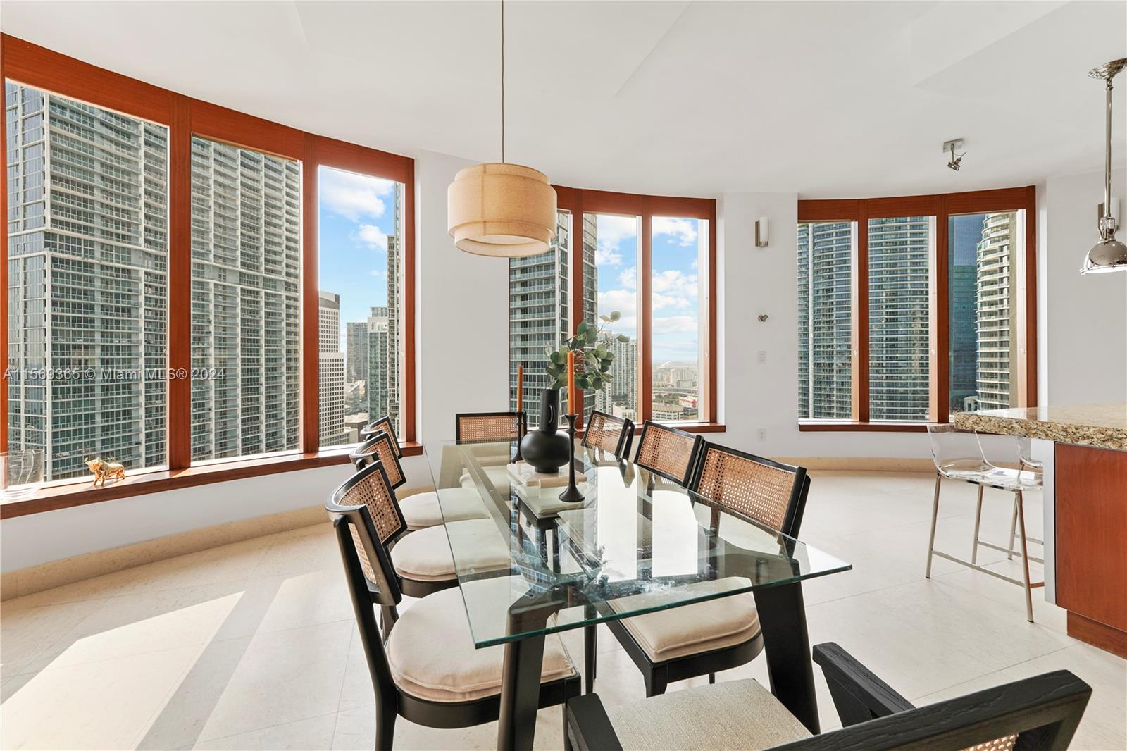 901 Brickell Key Boulevard, Unit 3504 Miami, FL 33131 - Photo 11 of 44 a living room with furniture and a large window