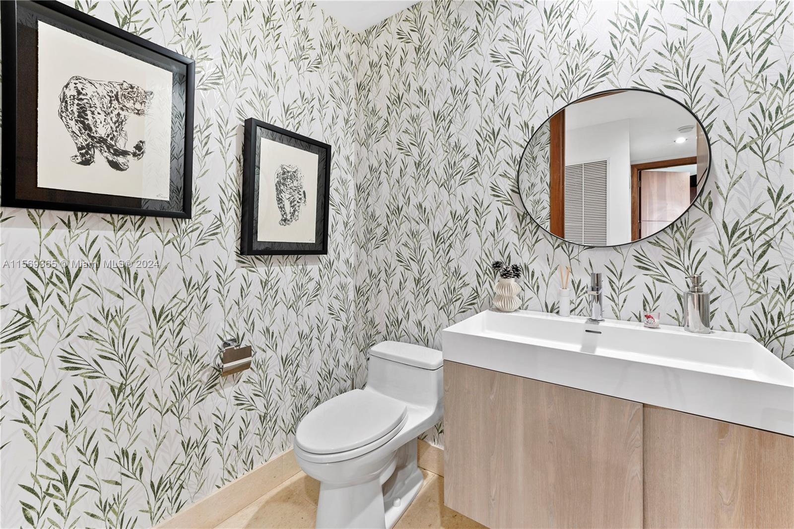 901 Brickell Key Boulevard, Unit 3504 Miami, FL 33131 - Photo 13 of 44 a bathroom with a toilet sink and mirror