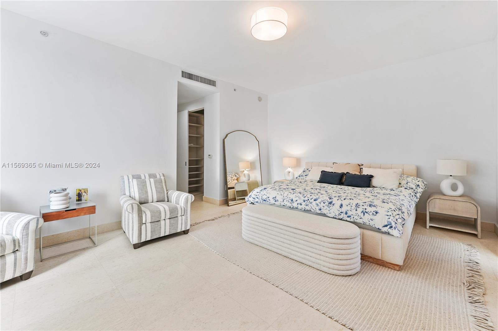 901 Brickell Key Boulevard, Unit 3504 Miami, FL 33131 - Photo 14 of 44 a bedroom with a bed and a couch