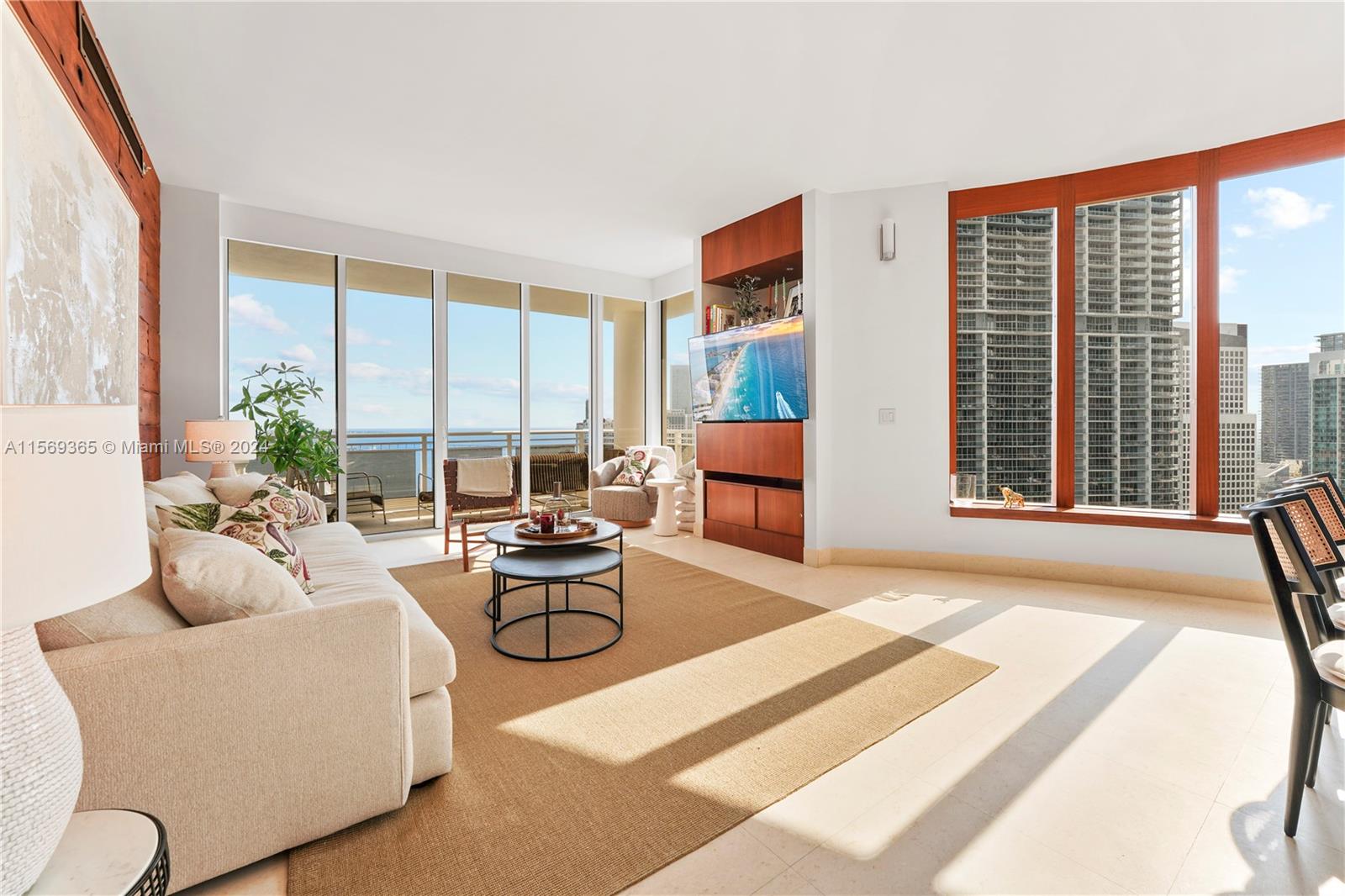 901 Brickell Key Boulevard, Unit 3504 Miami, FL 33131 - Photo 3 of 44 a living room with furniture and floor to ceiling windows