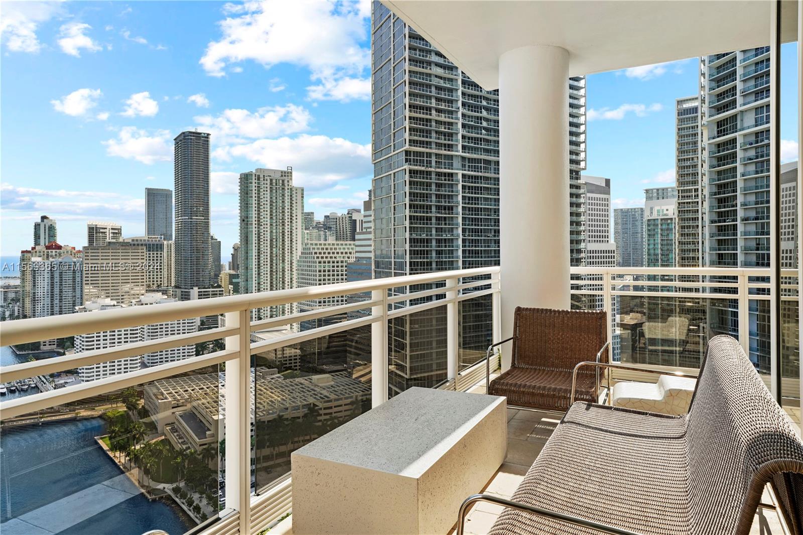 901 Brickell Key Boulevard, Unit 3504 Miami, FL 33131 - Photo 31 of 44 a view of a balcony with a couch