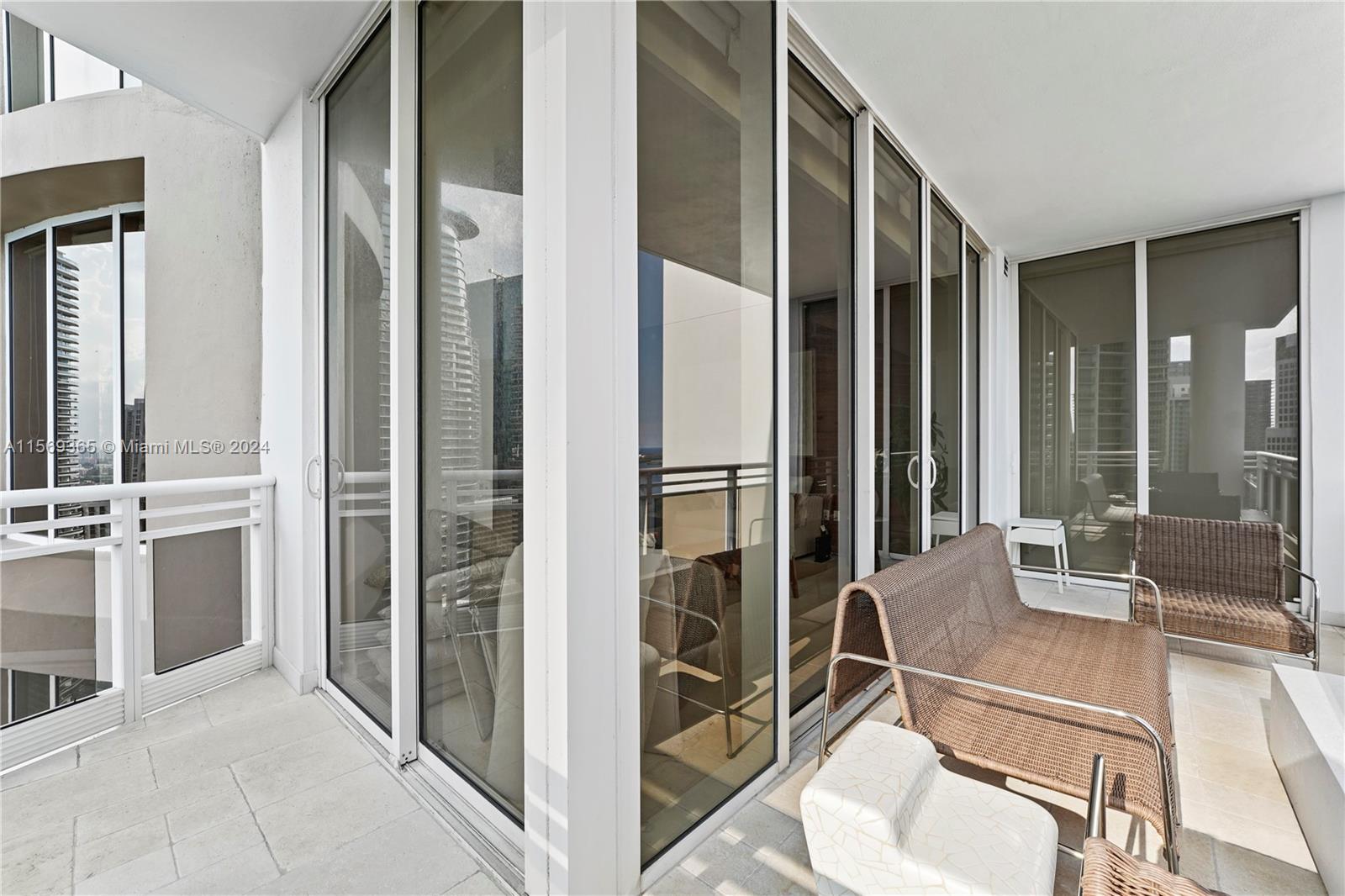 901 Brickell Key Boulevard, Unit 3504 Miami, FL 33131 - Photo 33 of 44 a room with stainless steel appliances a sink and chandelier