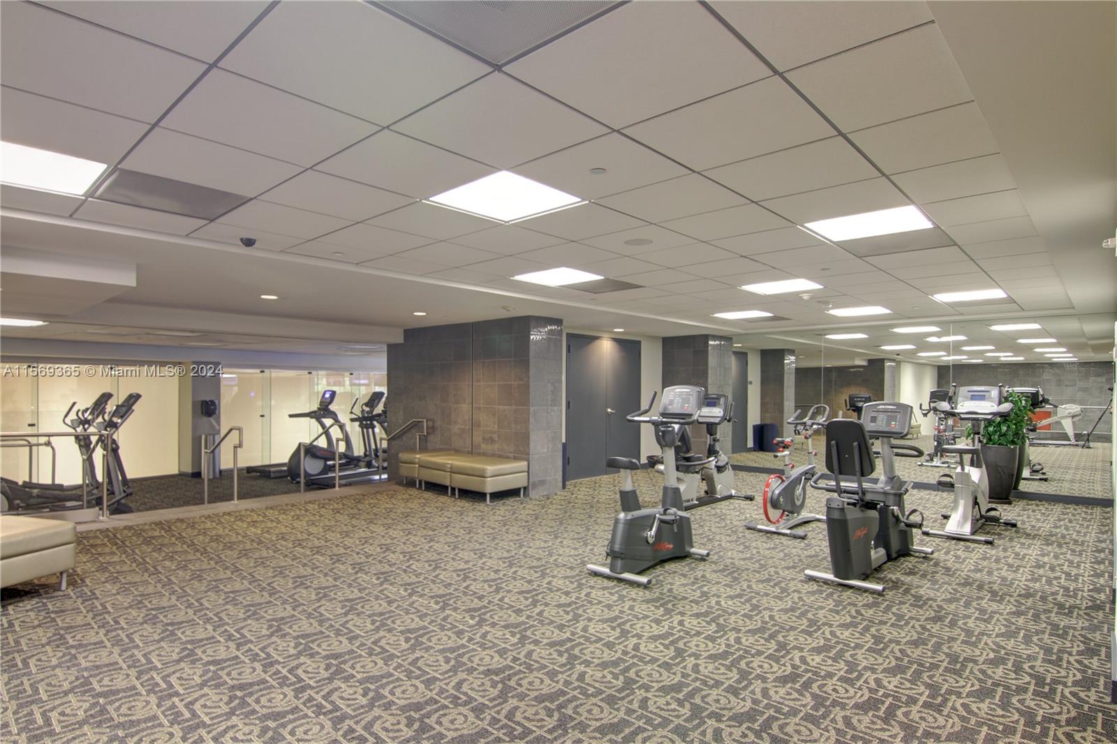 901 Brickell Key Boulevard, Unit 3504 Miami, FL 33131 - Photo 39 of 44 a room with lots of table and chairs