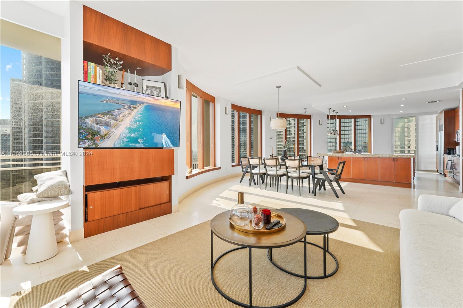 901 Brickell Key Boulevard, Unit 3504 Miami, FL 33131 - Photo 4 of 44 a living room with furniture and a large window