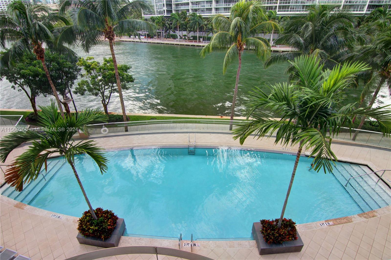 901 Brickell Key Boulevard, Unit 3504 Miami, FL 33131 - Photo 43 of 44 a view of a lake from a terrace