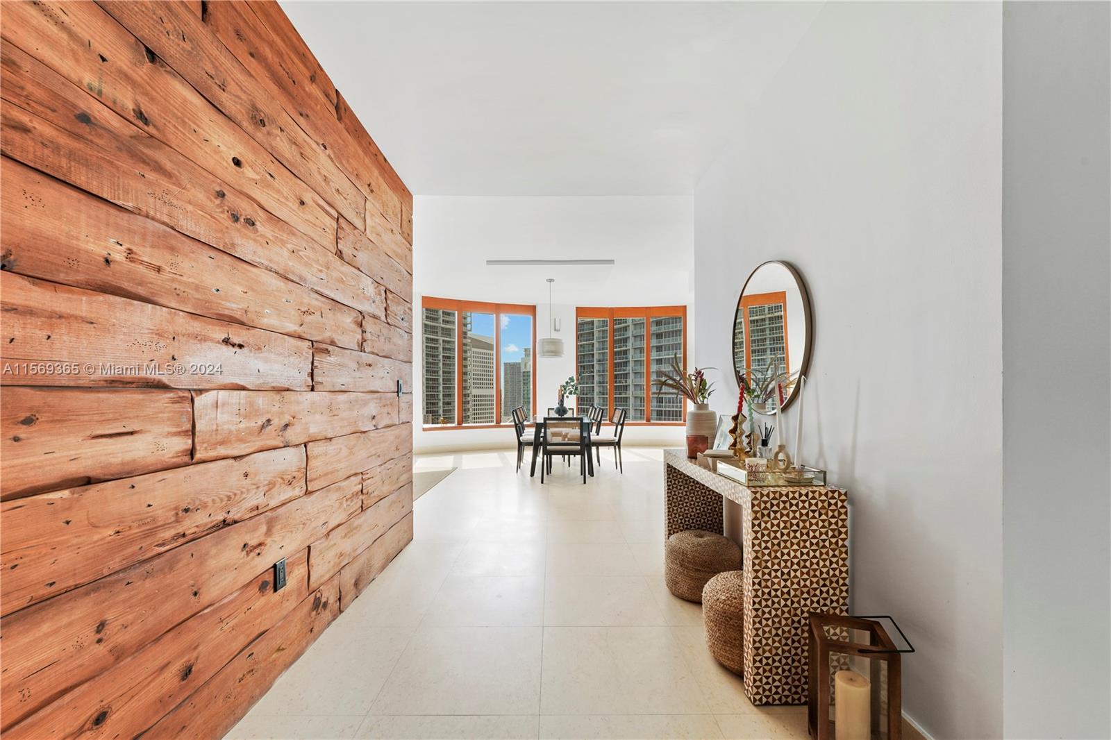901 Brickell Key Boulevard, Unit 3504 Miami, FL 33131 - Photo 5 of 44 a living room with furniture and wooden floor