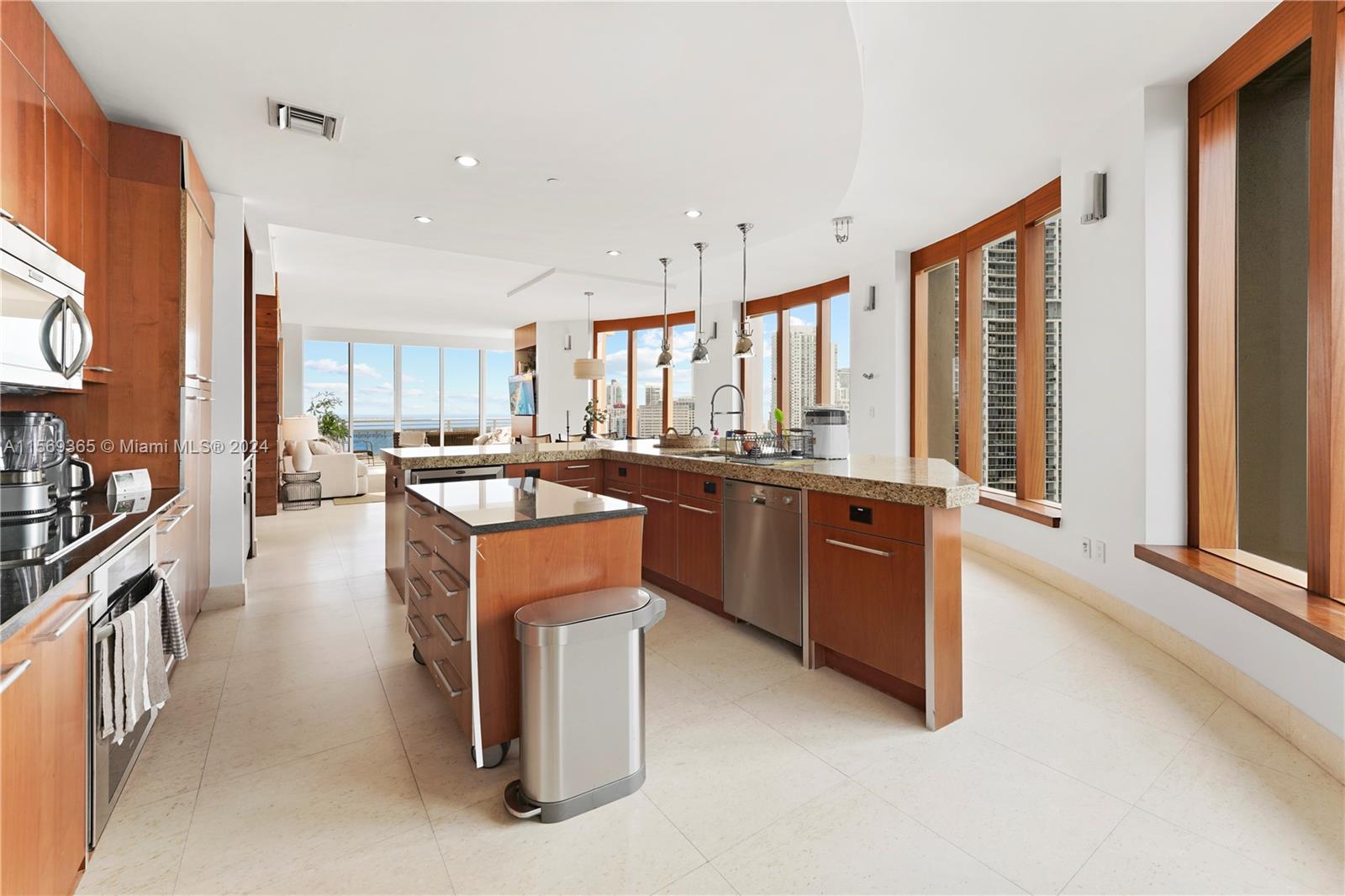 901 Brickell Key Boulevard, Unit 3504 Miami, FL 33131 - Photo 7 of 44 a kitchen with a sink stove and cabinets