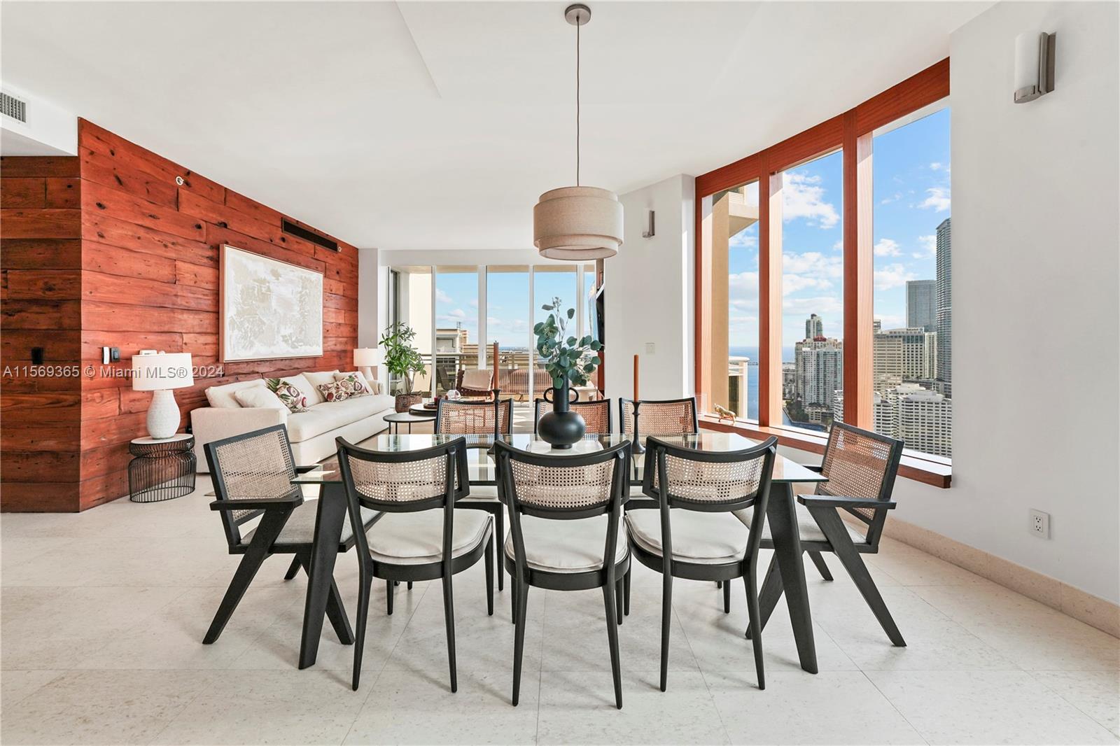 901 Brickell Key Boulevard, Unit 3504 Miami, FL 33131 - Photo 9 of 44 a dining room with furniture and window
