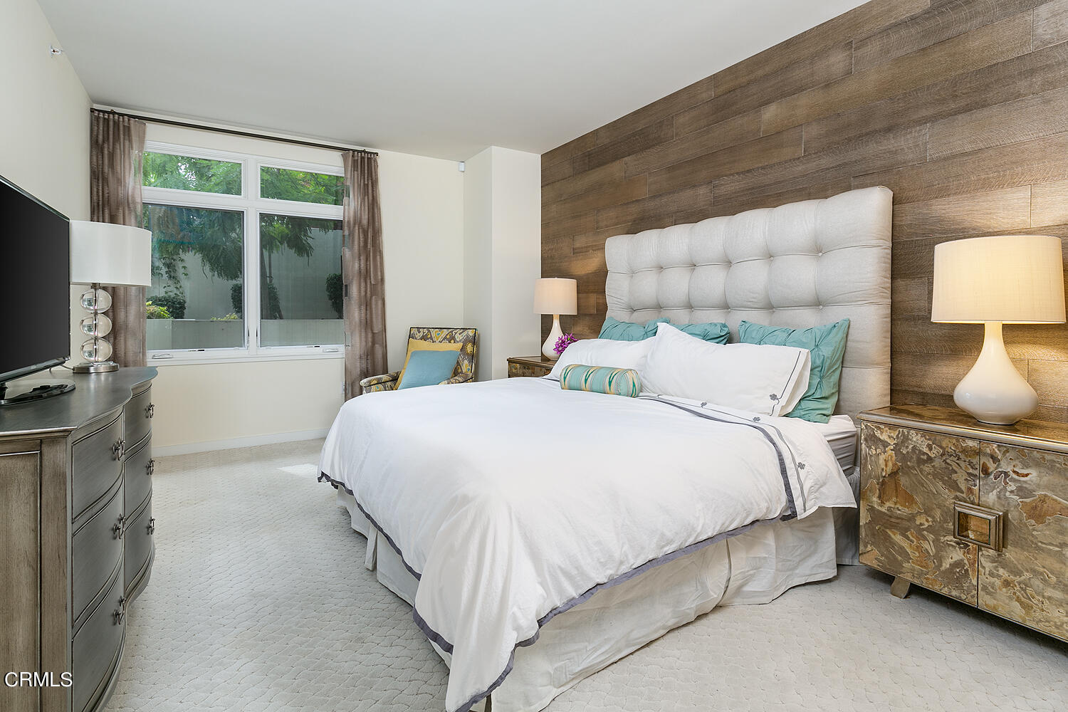 920 Granite Drive, Unit 103 Pasadena, CA 91101 - Photo 13 of 33 a bedroom with a bed and a flat tv screen on the dresser