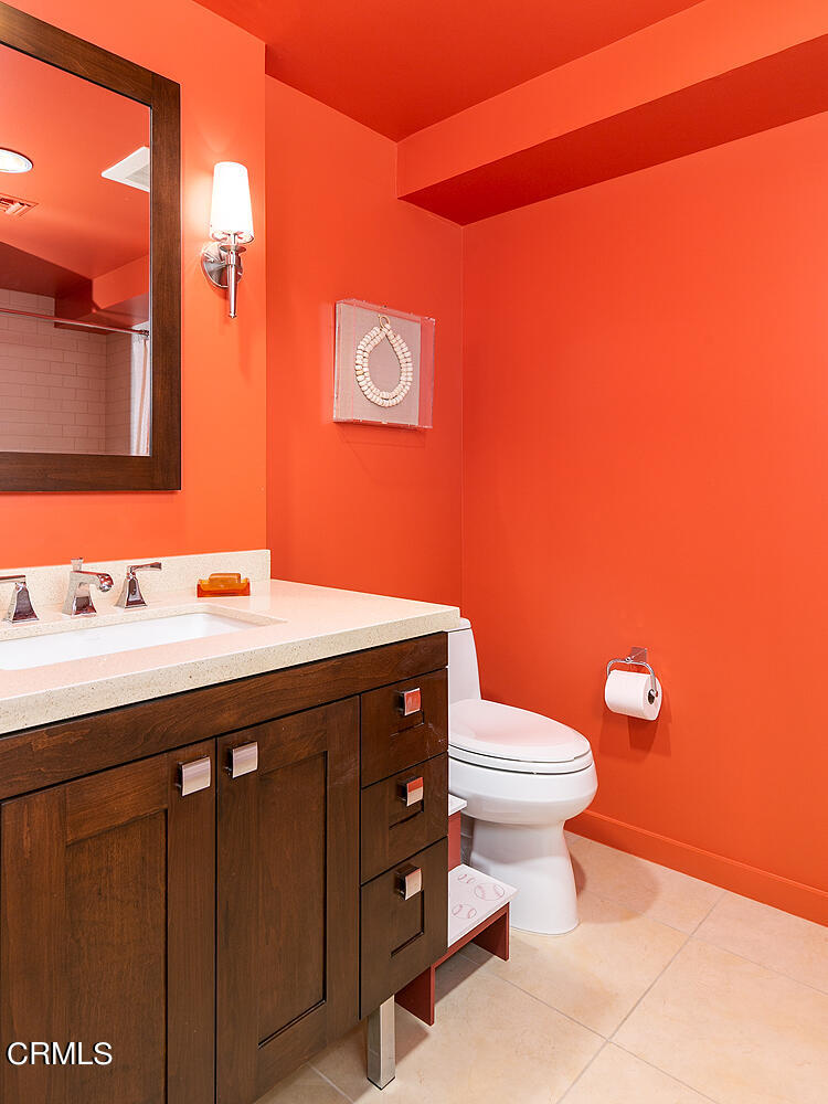 920 Granite Drive, Unit 103 Pasadena, CA 91101 - Photo 21 of 33 a bathroom with a sink a toilet and mirror