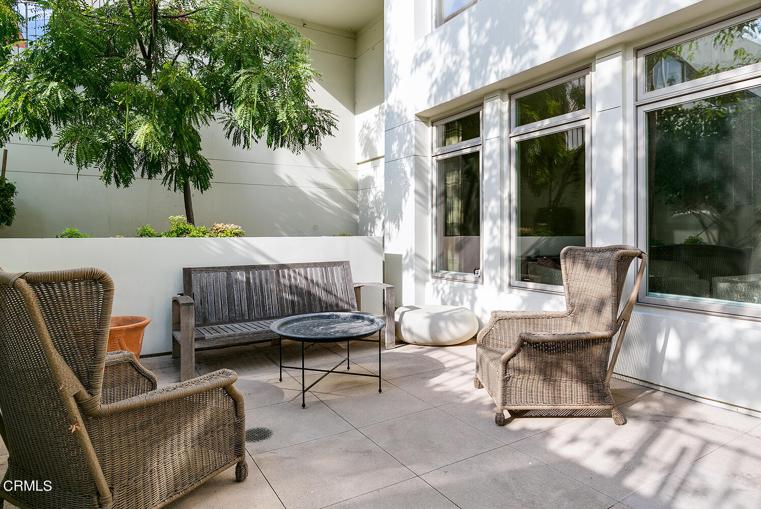 920 Granite Drive, Unit 103 Pasadena, CA 91101 - Photo 24 of 33 a view of a patio with couches and a potted plant on a table