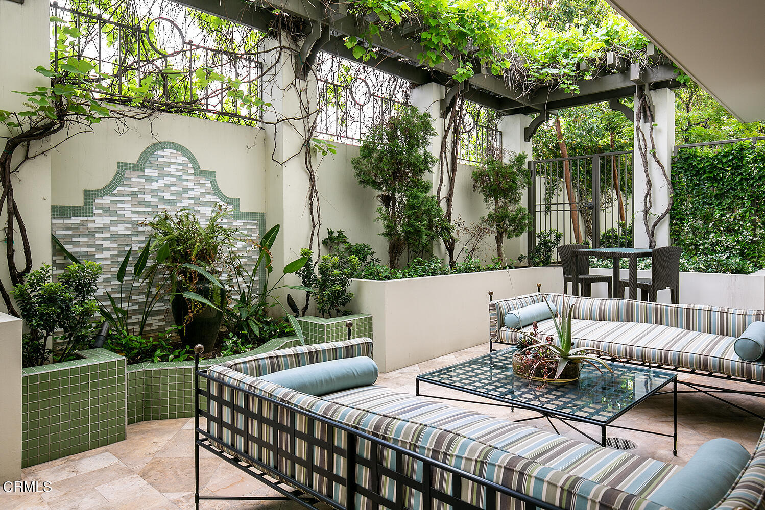 920 Granite Drive, Unit 103 Pasadena, CA 91101 - Photo 28 of 33 a view of table and chairs in patio