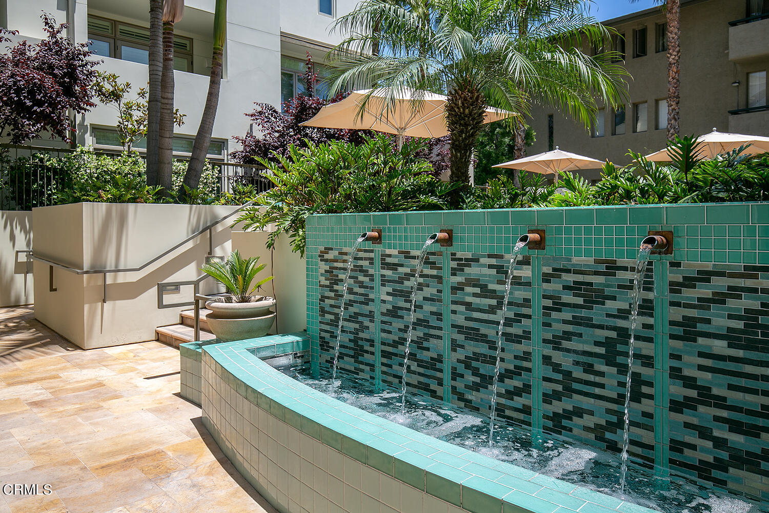 920 Granite Drive, Unit 103 Pasadena, CA 91101 - Photo 29 of 33 a view of a terrace with chairs and umbrella