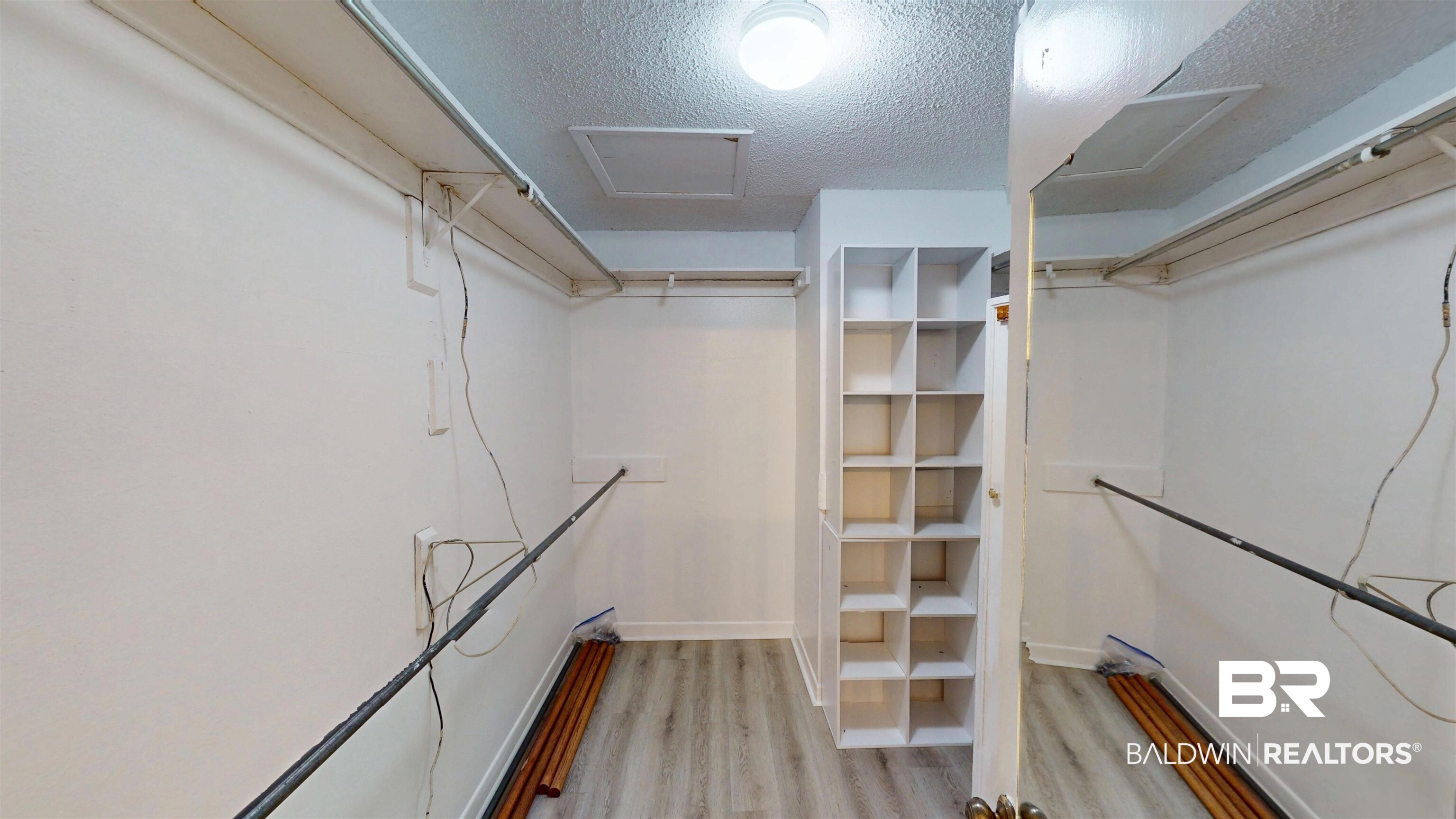 2901 Grant Street, Unit 902 Mobile, AL 36606 - Photo 16 of 35 Walk in closet with attic access and light wood finished floors
