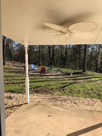a view of swimming pool with a patio