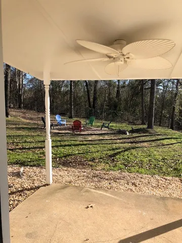 a view of swimming pool with a patio