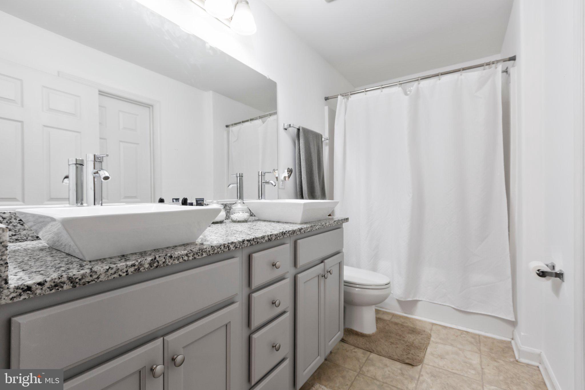 2906 Minor Road Bumpass, VA 23024 - Photo 22 of 48 Tub/shower combo w/ granite draped double sink