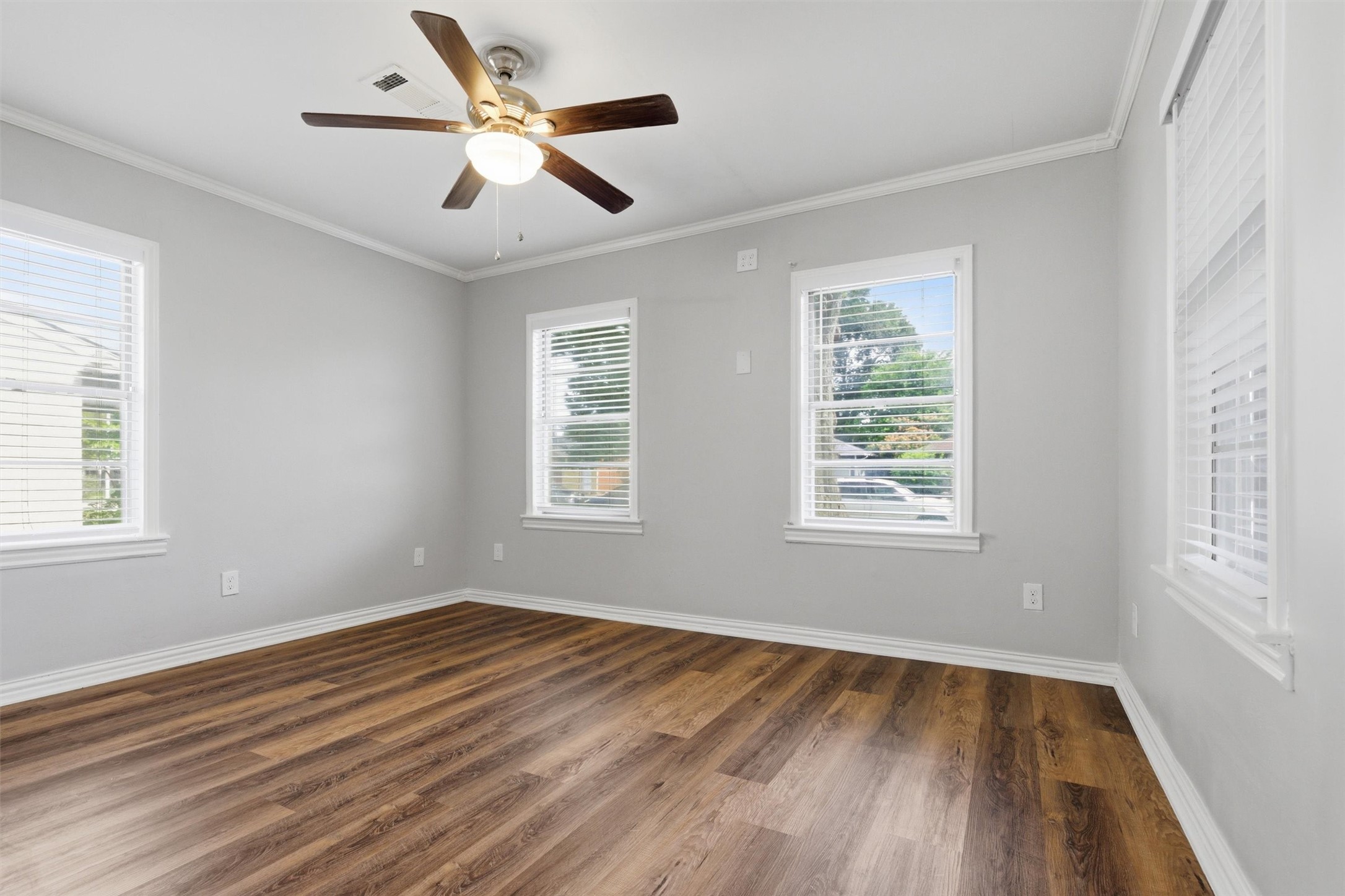 3615 Alberta Street Houston, TX 77021 - Photo 13 of 16 a view of an empty room with wooden floor and a window