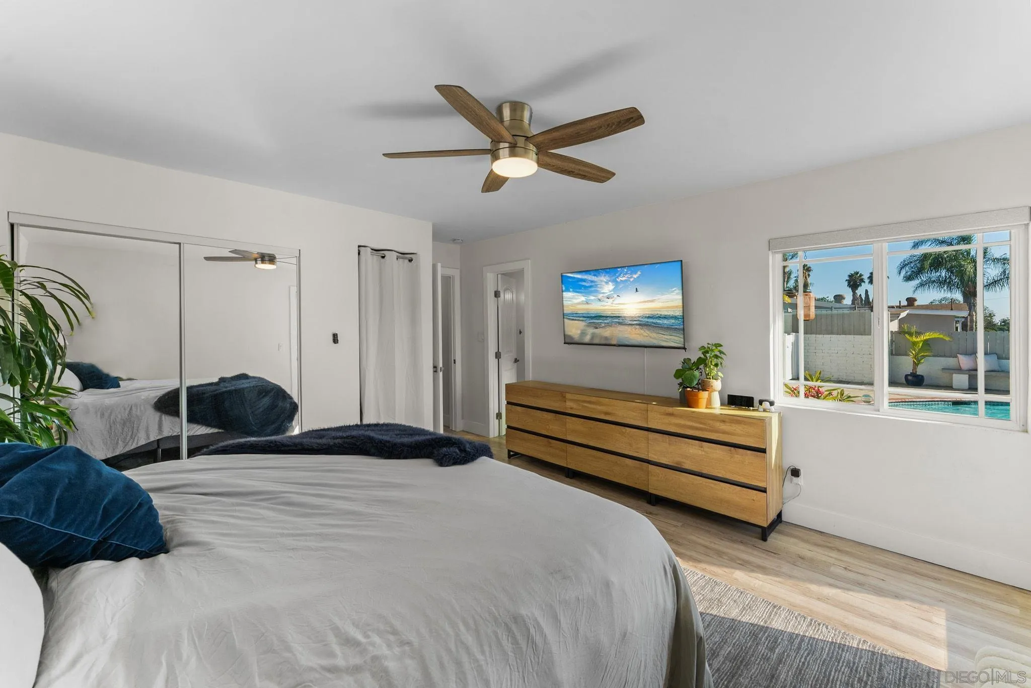 2618 Sheri Lane Lemon Grove, CA 91945 - Photo 11 of 39 a bedroom with a bed a window and potted plant