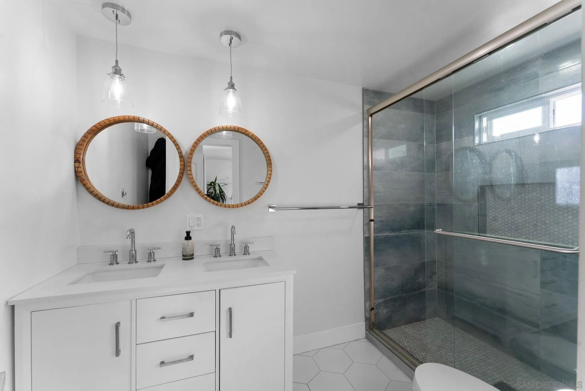 2618 Sheri Lane Lemon Grove, CA 91945 - Photo 12 of 39 a bathroom with a sink mirror and a shower