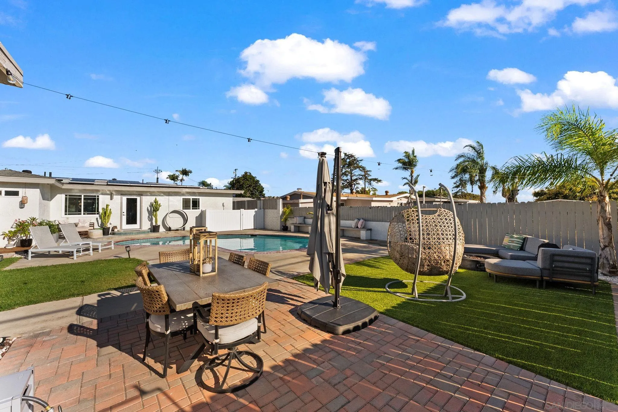 2618 Sheri Lane Lemon Grove, CA 91945 - Photo 23 of 39 a view of a swimming pool and lounge chairs