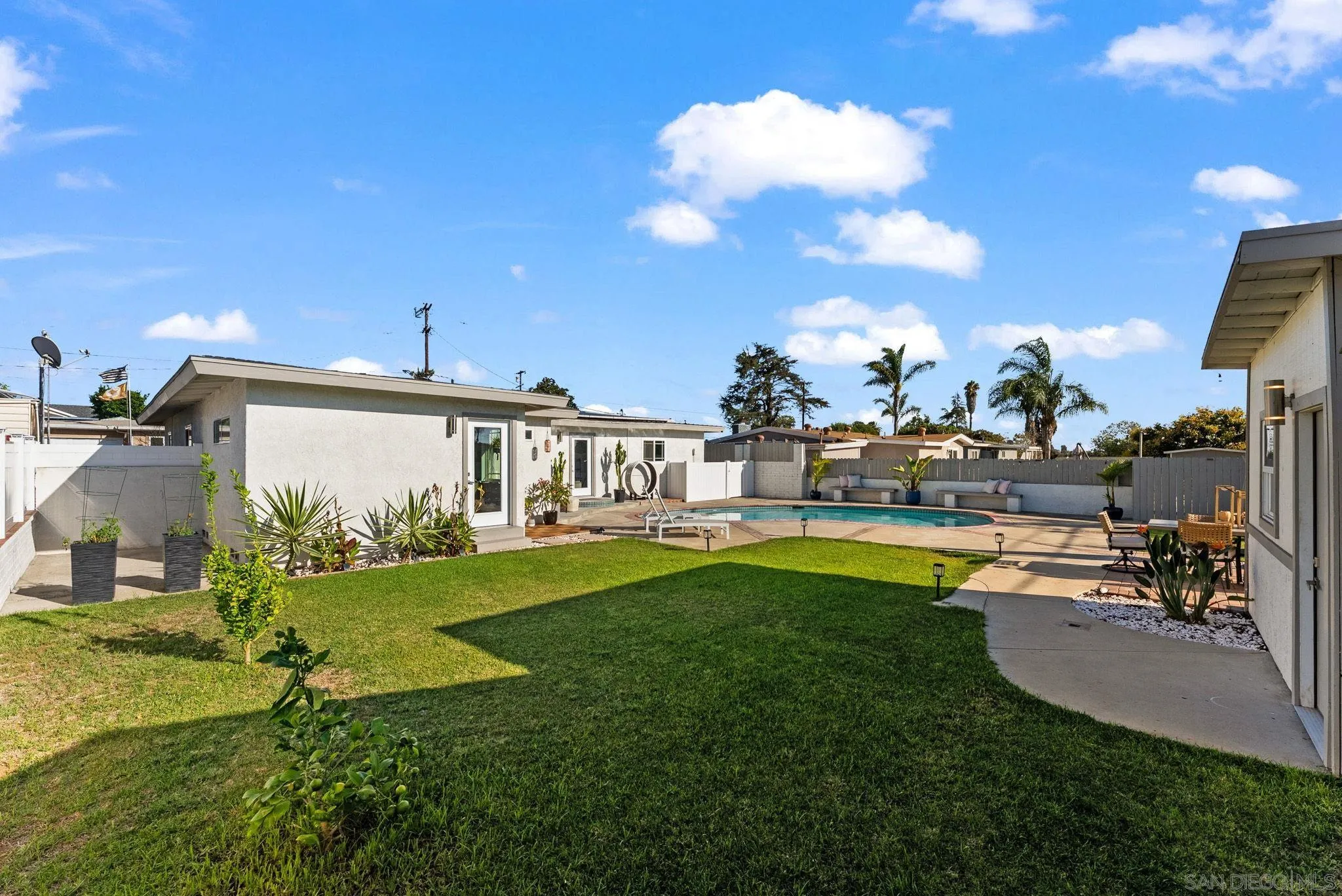 2618 Sheri Lane Lemon Grove, CA 91945 - Photo 24 of 39 a view of a house with swimming pool and a yard
