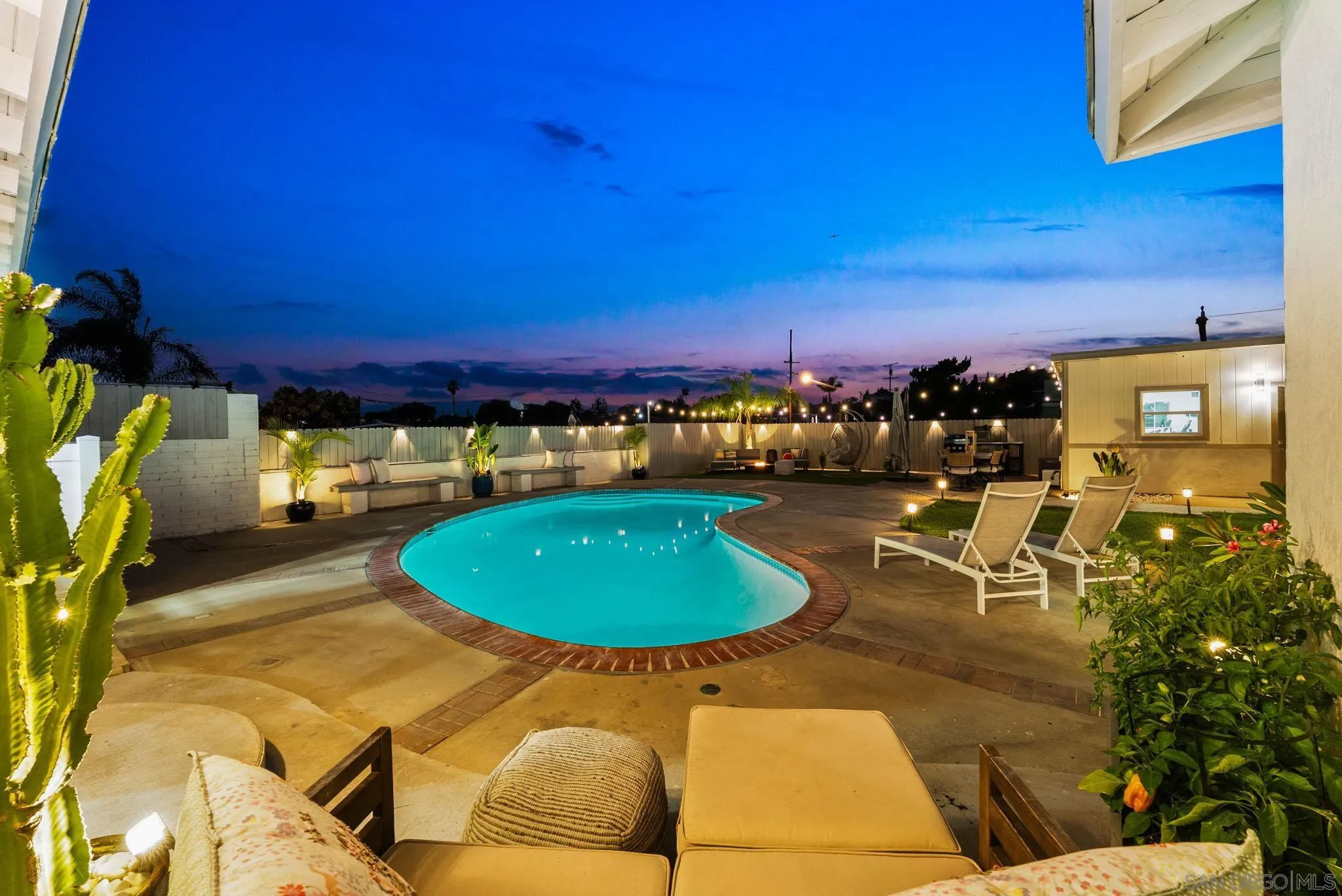 2618 Sheri Lane Lemon Grove, CA 91945 - Photo 33 of 39 a view of a swimming pool with a table and chairs