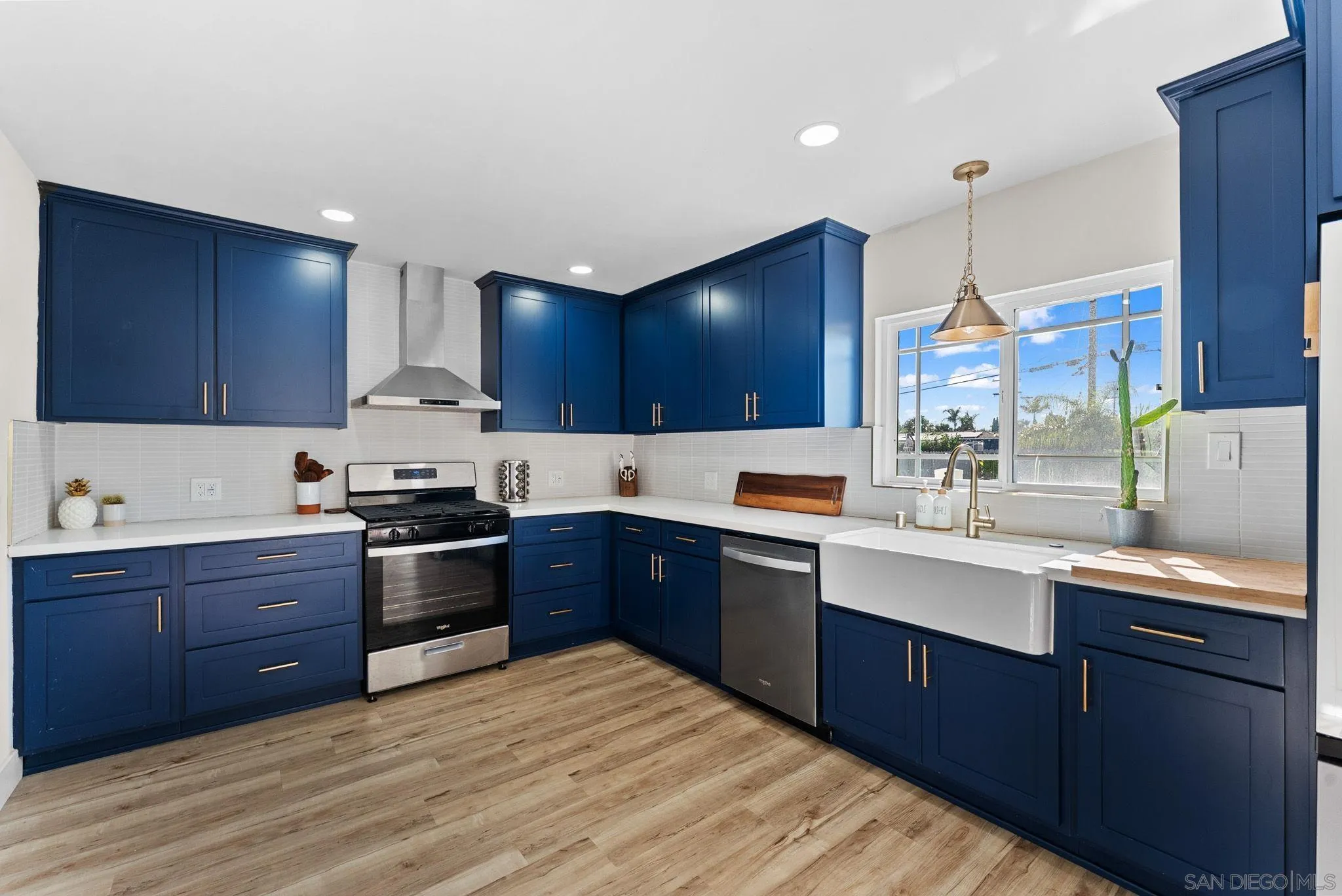2618 Sheri Lane Lemon Grove, CA 91945 - Photo 8 of 39 a kitchen with stainless steel appliances granite countertop a sink stove and refrigerator