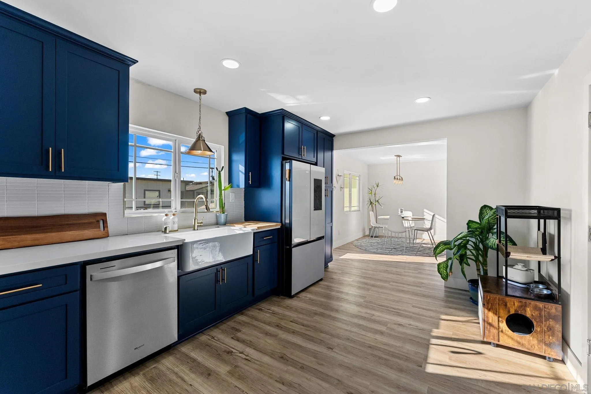 2618 Sheri Lane Lemon Grove, CA 91945 - Photo 9 of 39 a large kitchen with stainless steel appliances a large counter top a stove and a wooden floors