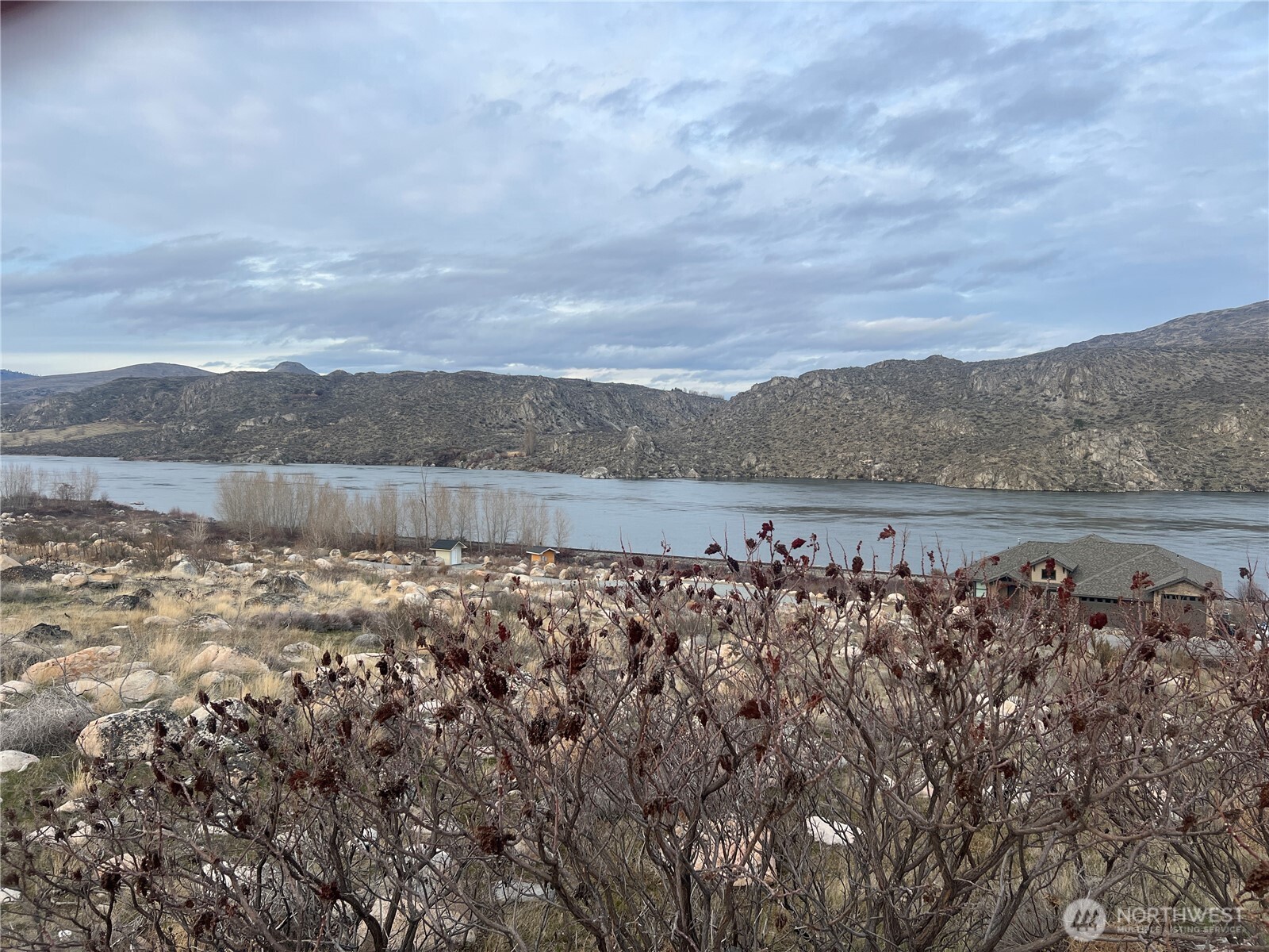 a view of a lake with mountains in the background