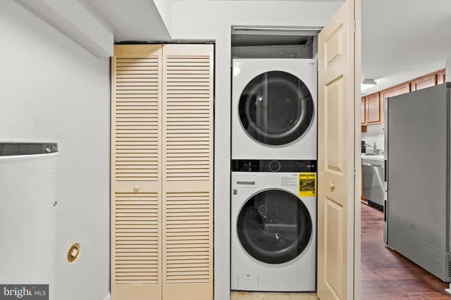 a view of a hallway with washer and dryer