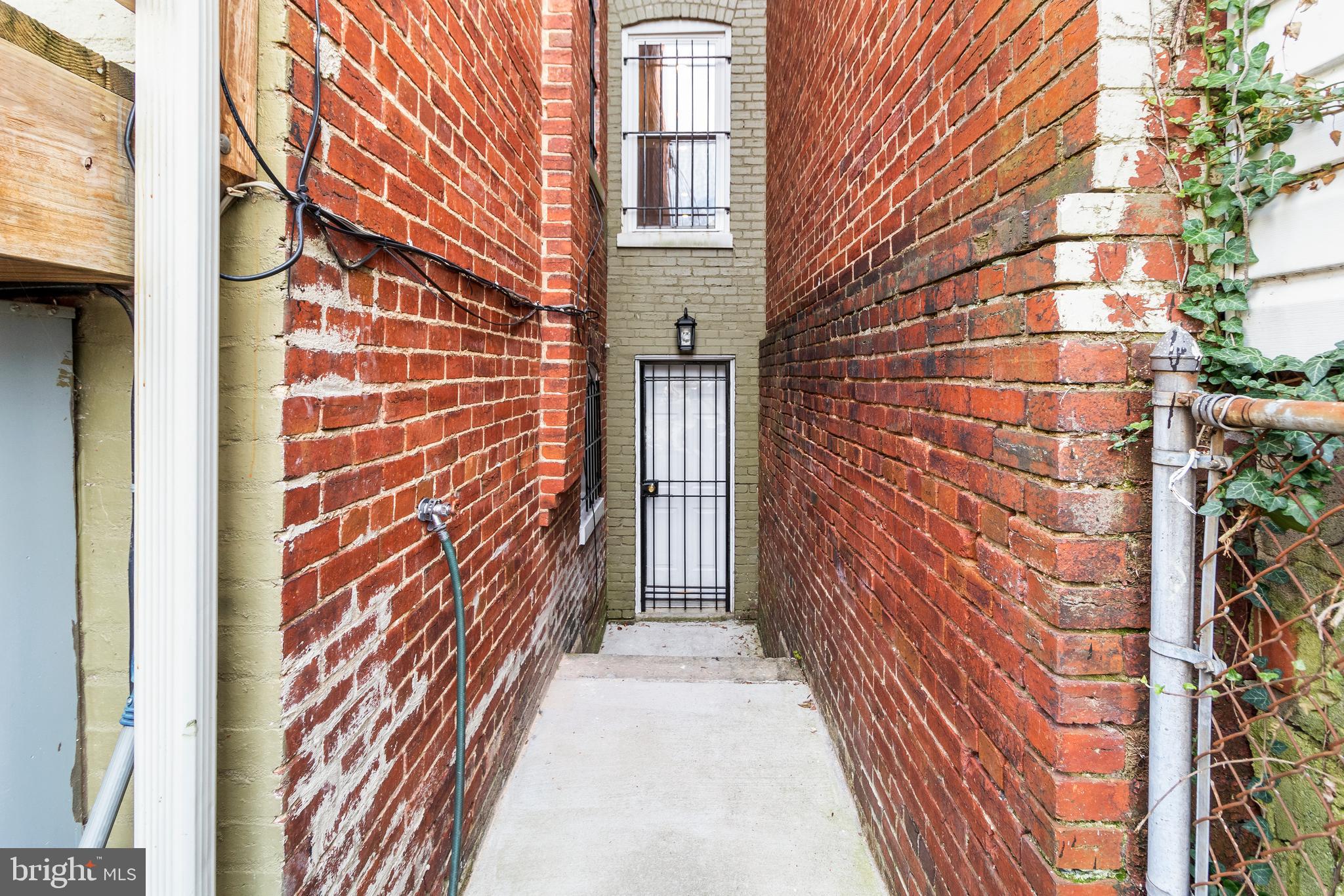 3612 Rock Creek Church Road Northwest, Unit LWR Washington, DC 20010 - Photo 19 of 19 a view of a brick buildings with entryway