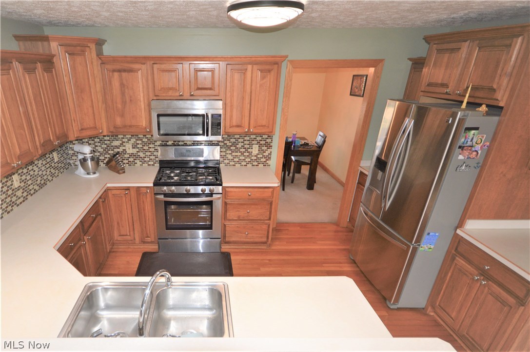 4112 Logans Way Perry, OH 44081 - Photo 12 of 29 U-Shape of counters makes this space extremely functional with plenty of counter space for baking, cooking, appliances or whatever!