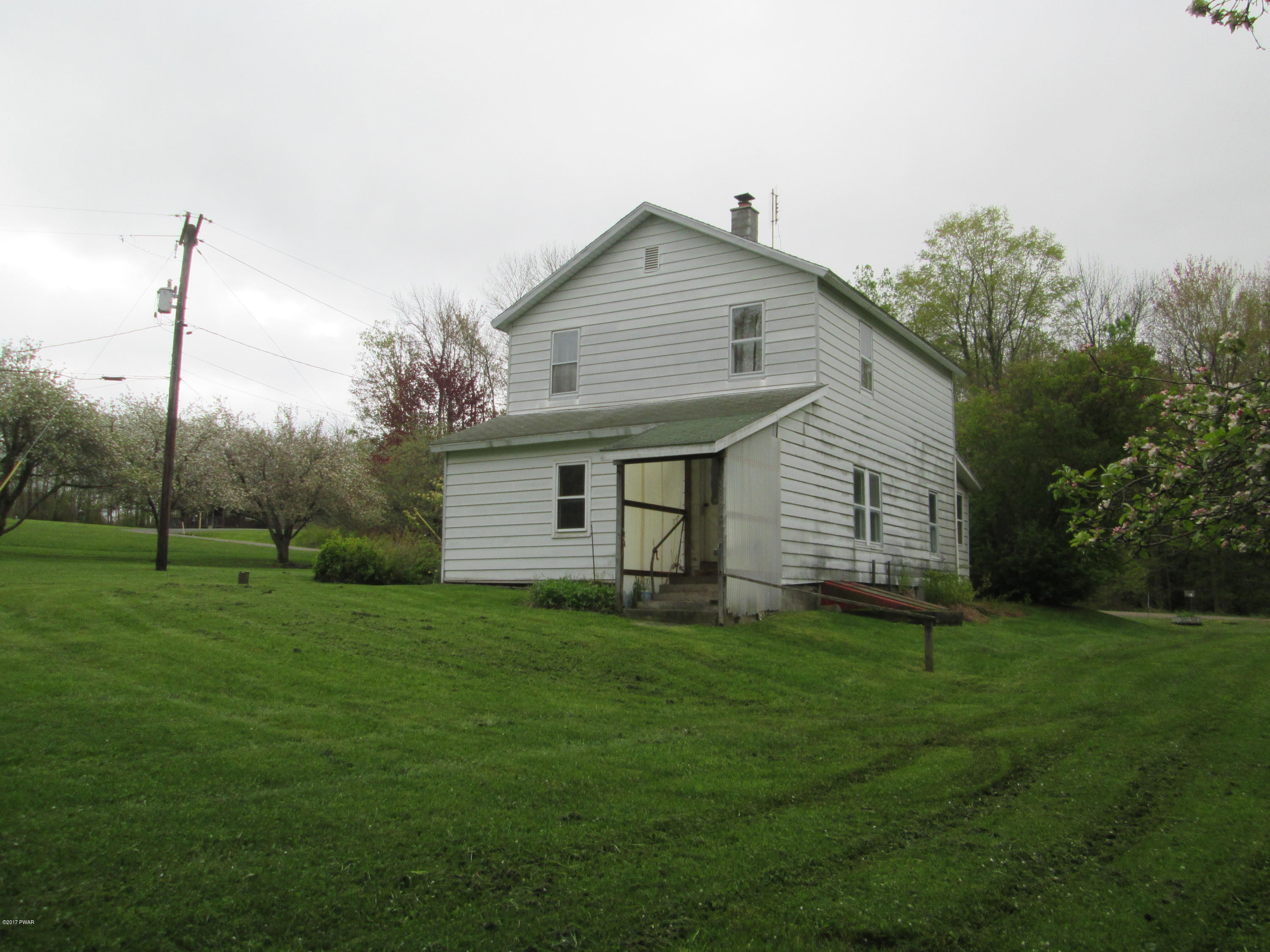 86 Beaver Hollow Road Lakewood, PA 18439 - Photo 24 of 30 a view of a house with a yard