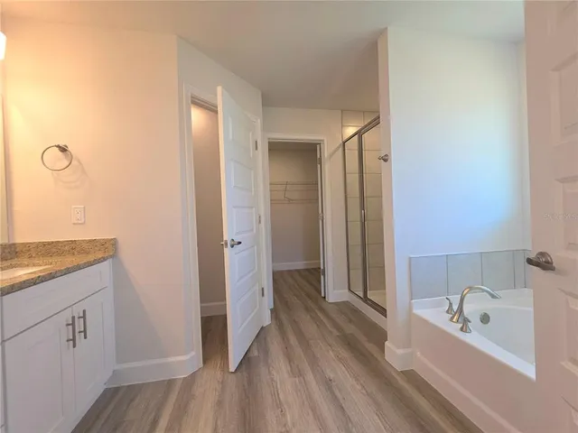 a bathroom with a bathtub and a sink