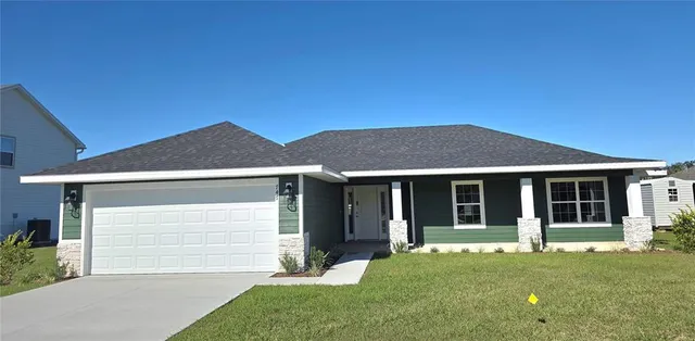 front view of a house with a yard