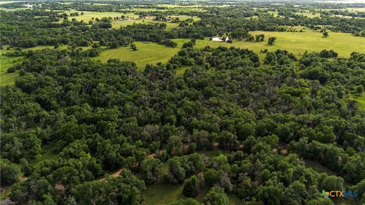 264 A Cameron, TX 76520 - Photo 3 of 4 an aerial view of residential houses with outdoor space and swimming pool