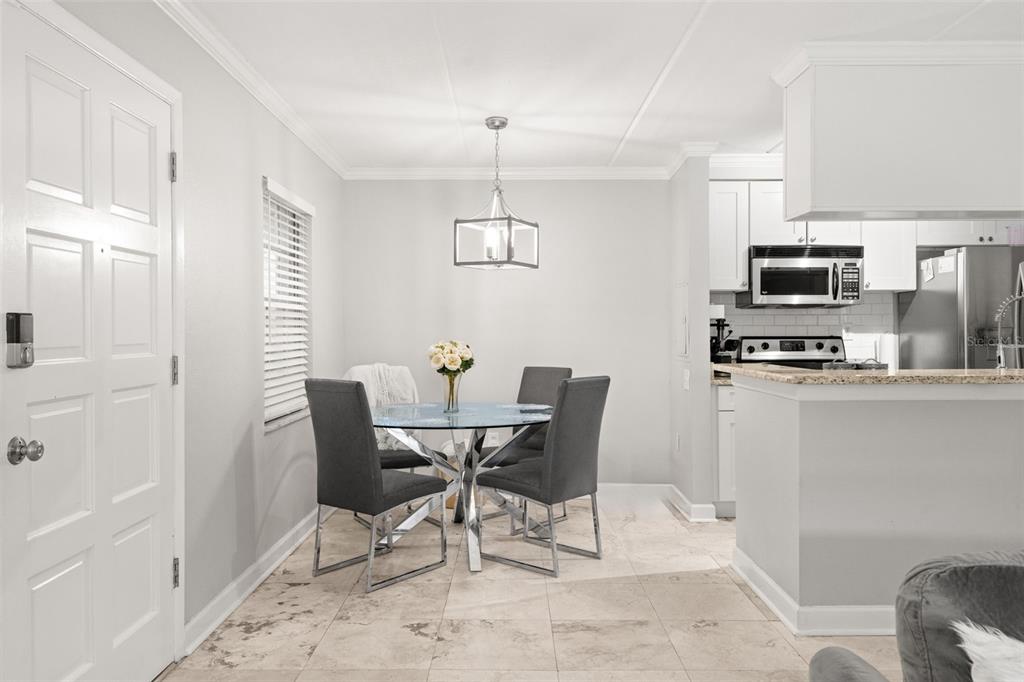 107 South Obrien Street, Unit 217 Tampa, FL 33609 - Photo 20 of 39 a dining room with furniture and window