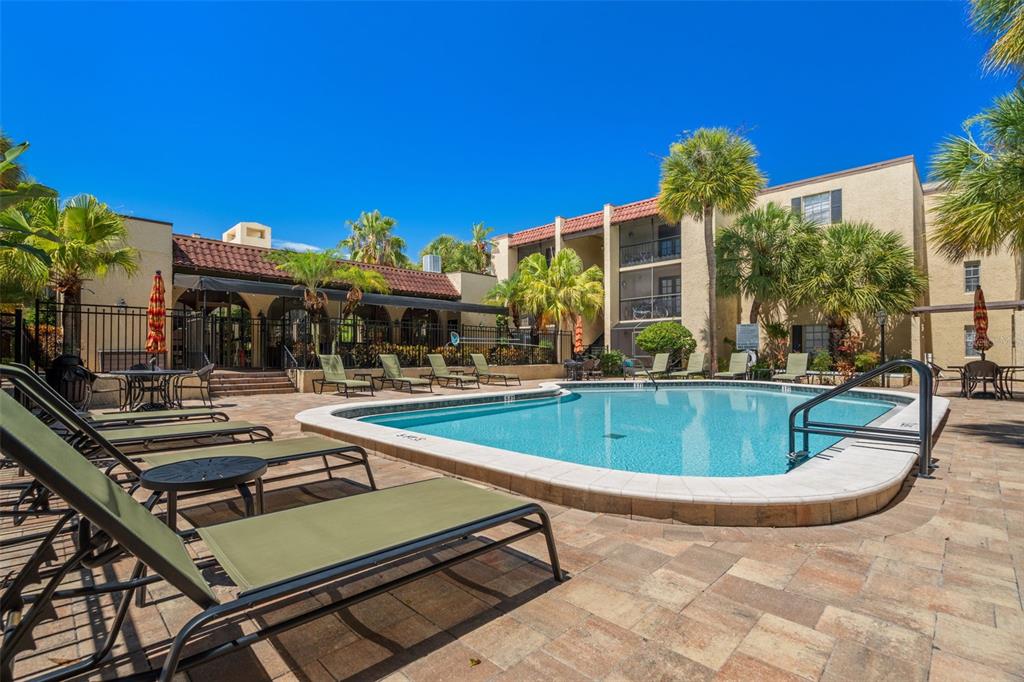 107 South Obrien Street, Unit 217 Tampa, FL 33609 - Photo 27 of 39 a view of a house with swimming pool and sitting area