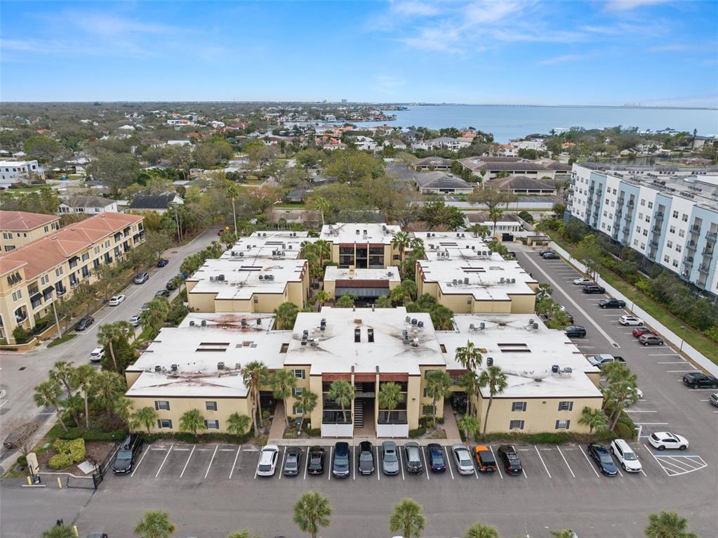 107 South Obrien Street, Unit 217 Tampa, FL 33609 - Photo 32 of 39 an aerial view of a city with lots of residential buildings ocean and mountain view in back