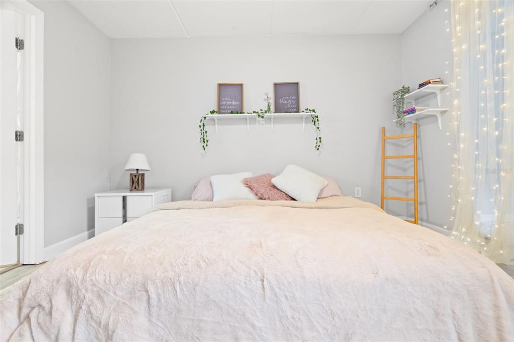 107 South Obrien Street, Unit 217 Tampa, FL 33609 - Photo 6 of 39 a large white bed in a white room