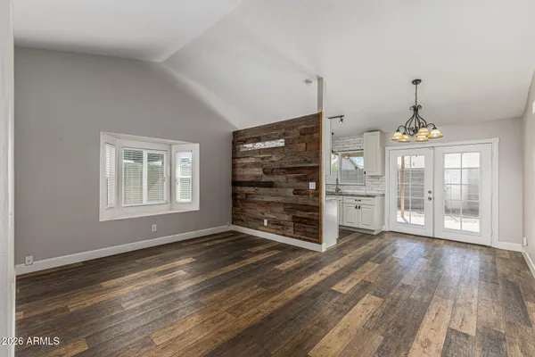 a view of a room with furniture wooden floor and window