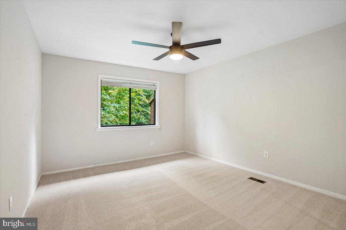 2021 Winged Foot Court Reston, VA 20191 - Photo 19 of 40 Bedroom 2 with lighted ceiling fan