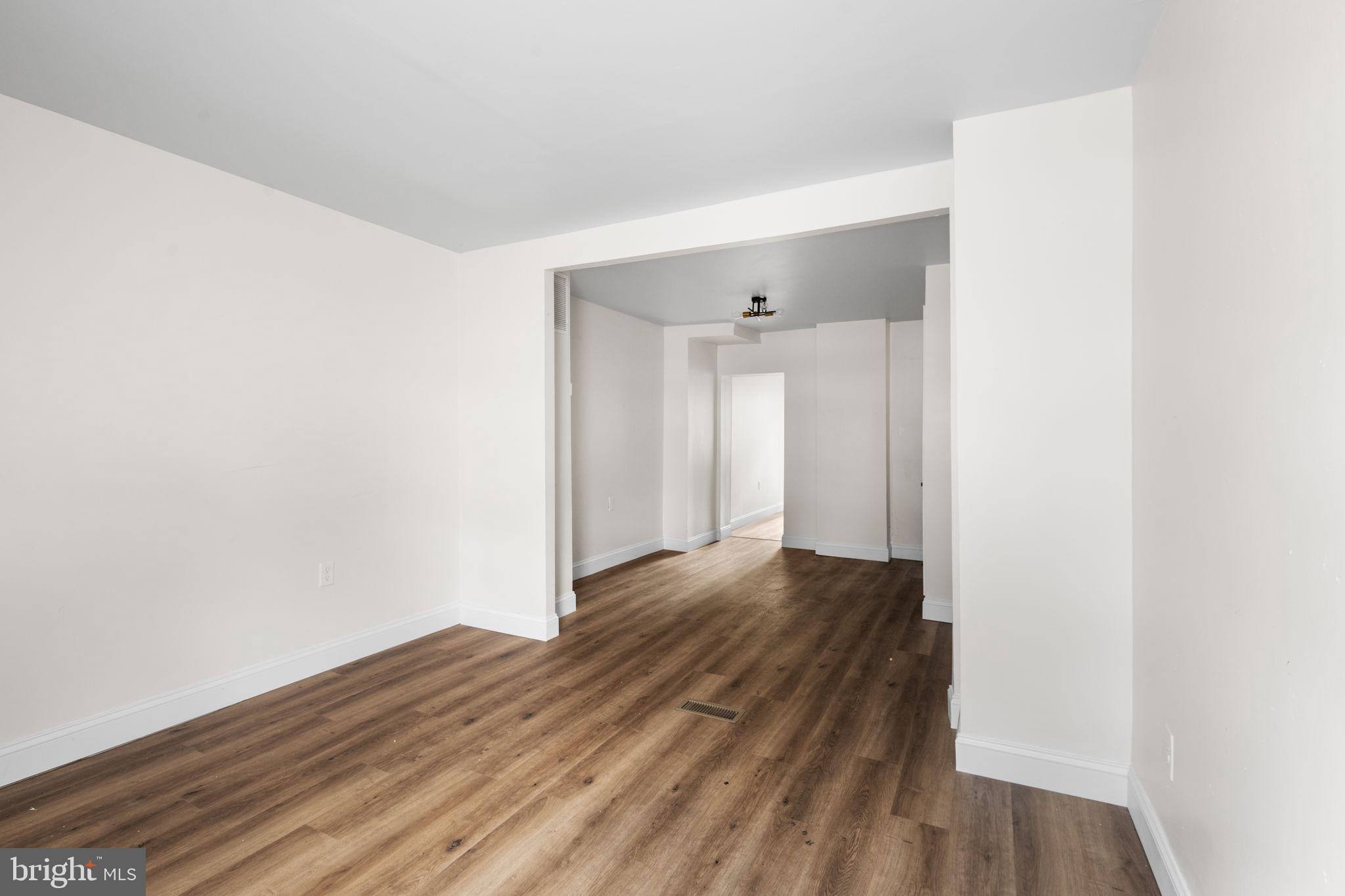 322 South Poppleton Street Baltimore, MD 21230 - Photo 5 of 34 Spacious, light-filled living area.