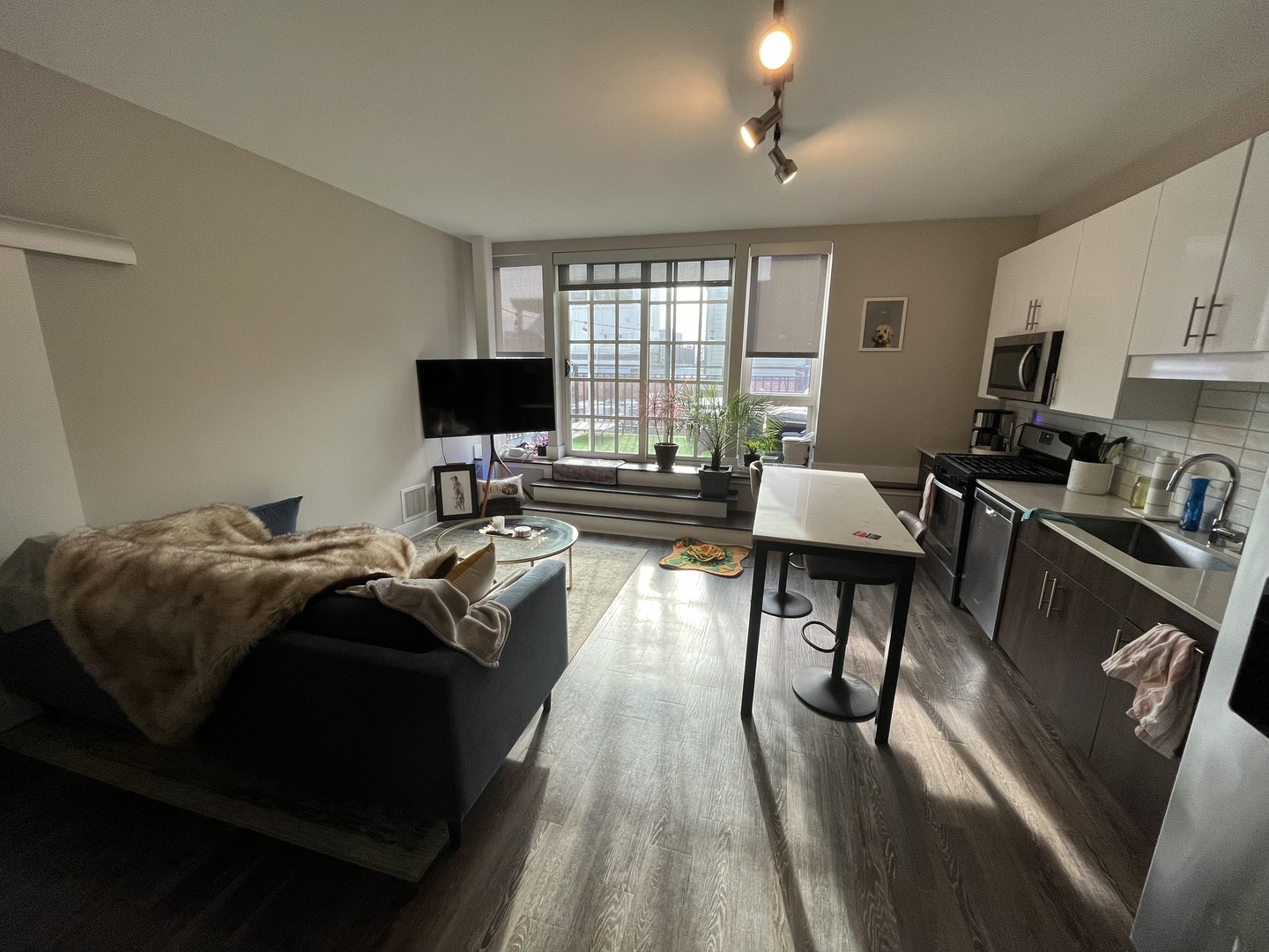 Undisclosed Address Chicago, IL 60640 - Photo 2 of 12 a living room with furniture and a flat screen tv