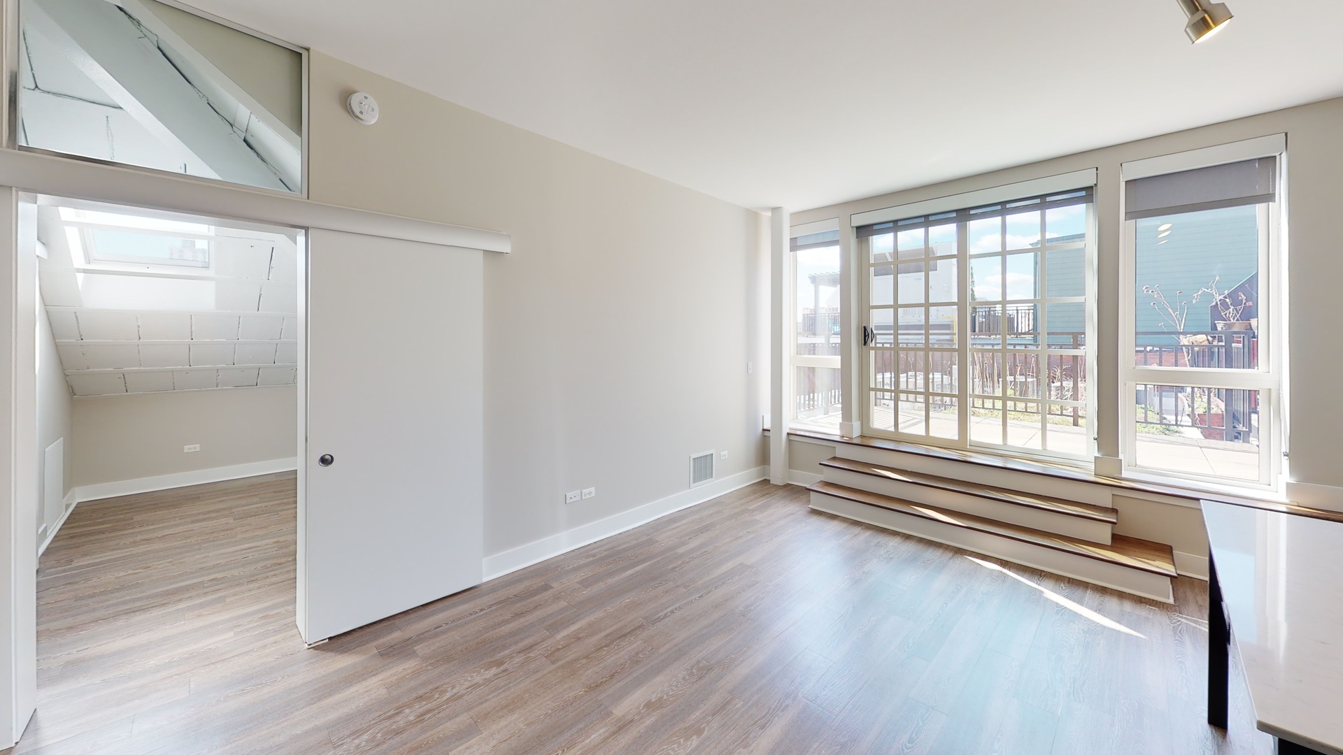 Undisclosed Address Chicago, IL 60640 - Photo 10 of 12 a view of empty room with wooden floor and fan