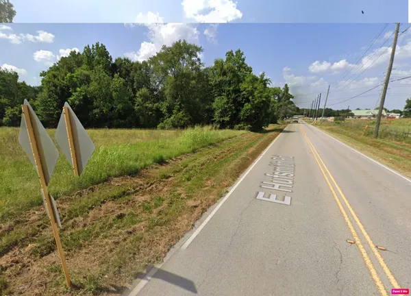 a view of a swimming pool with a yard