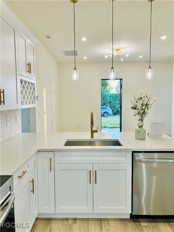 3804 6th Street Southwest Lehigh Acres, FL 33976 - Photo 15 of 45 a kitchen with white cabinets and sink
